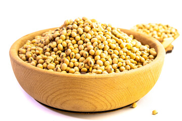 Organic soy beans falling into a rustic wicker bowl. Raw dried soya grains. Healthy legume ingredient. Rotation. Food