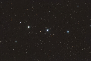 You are looking at four stars in the Perseus constellation called 56 Persei, 55 Persei, V590 Persei and HIP 20573. You can also see a faint galaxy called UGC 3028, taken with amateur telescope.