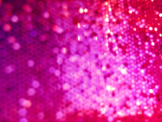 Purple de focused sparkle glitter background with bokeh effect