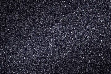 Dark gray glitter paper texture as background	