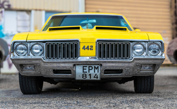 Gothenburg, Sweden - August 24 2024: Front of a yellow 1970 Oldsmobile 442.