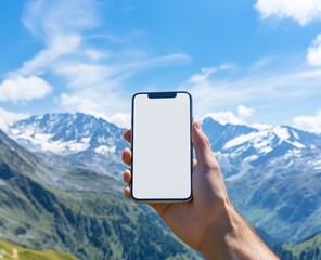 Hand holding a smartphone with a blank screen, set against the backdrop of nature and mountains