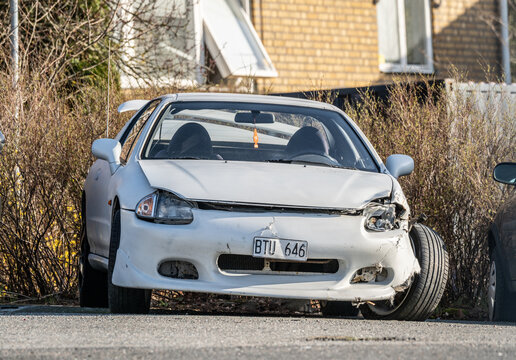 Gothenburg, Sweden - April 07 2024: Badly crash damaged white 1993 Honda Civic Coupe CRX.