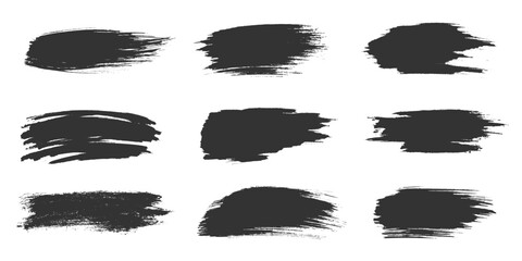 Black brush strokes set with rough edges uneven shapes. Bold smears, textured lines, messy marks, abstract smudges. Features dynamic forms with irregular patterns, sharp edges, textured surfaces