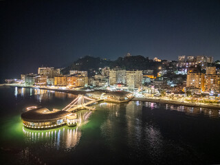 Aerial drone view of the coastal town of Durres in Albania by night.