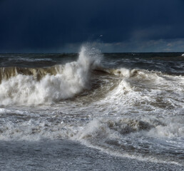 Stormy sea waves, sea foam and water splashes. Nature background