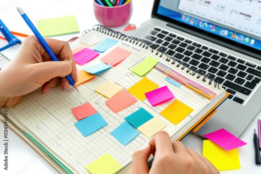 Poster A detailed closeup view of a person meticulously organizing their goals in a notebook using colorful sticky notes, which is placed next to a laptop within a vibrant and inspiring workspace area