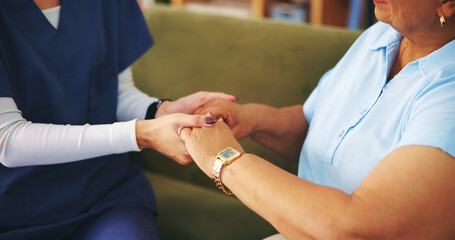 Senior woman, nurse and holding hands for empathy in home with grief, support and compassion for loss. Sympathy, old person and caregiver with comfort on sofa for wellbeing or help with mental health