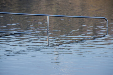Steel railing in the water