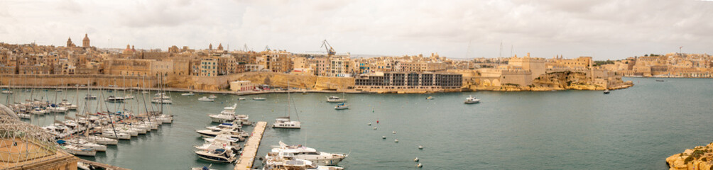 Valletta (il-Belt Valletta) massive fortification city wall and Fort St. Angelo from harbour Xlokk...