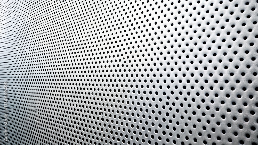 Leinwandbilder a repeating pattern of circular holes in a metallic surface, creating a textured and industrial aest