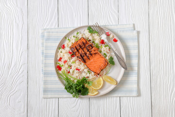 grilled red salmon fillet with rice, top view