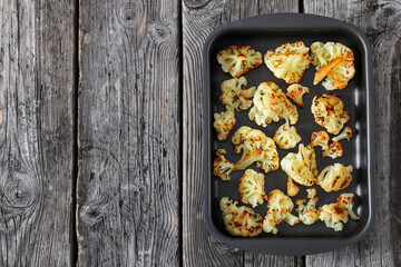oven baked cauliflower florets in a baking tray