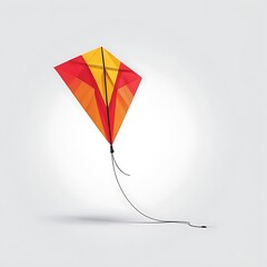 a kite with a red and yellow design is flying in the air