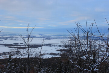 view from the mountain to snow-covered settlements