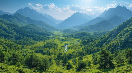 Fototapeta premium A serene valley surrounded by mountains, featuring lush greenery and a winding river.