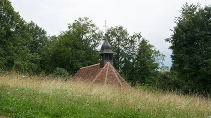 Tranquil Countryside Chapel Amidst Lush Greenery and Rolling Meadows