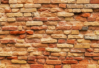 Dirty red brick wall construction material pattern background