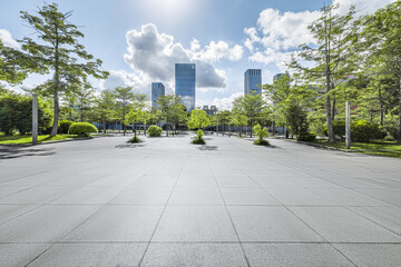 Empty brick floor and modern city buildings background