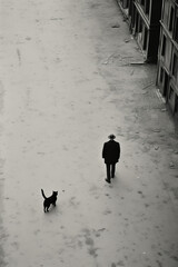Bird's-Eye View Black and White Photography of Man and Black Cat in Minimalist Background