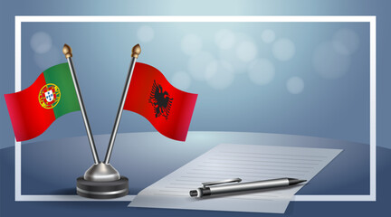 Portugal and Albania National flags on small table with bokeh background, cooperative relationship