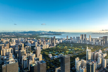 Obraz premium Modern city skyline and natural scenery at sunrise in Shenzhen, China