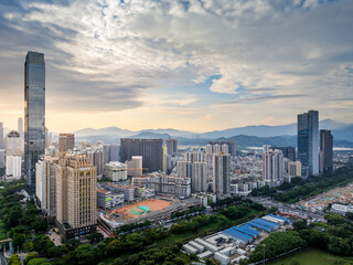Obraz premium Modern city skyline and natural scenery at sunrise in Shenzhen, China