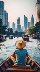 Obraz premium Serene Bangkok Canal Ride: A Person in a Traditional Hat Navigates the City's Waterways Amidst Modern Skyscrapers