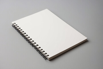 Blank realistic spiral bound notepad mockup on light grey background.