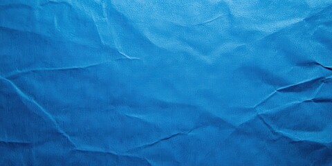 Obraz premium Textured Blue Background with Creases and Wrinkles, Ideal for Design Projects and Creative Contexts, Perfect for Printing and Digital Media Applications