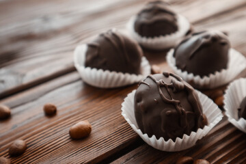 Tasty chocolate bonbon sweets on table