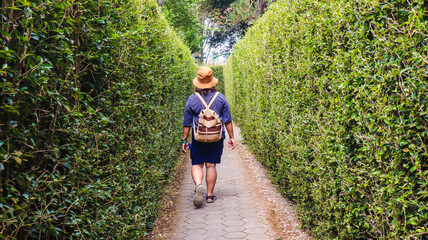 young woman walking in the maze park