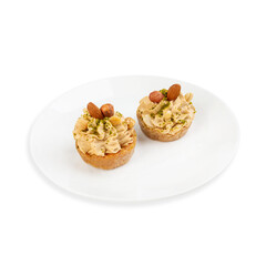 Nut cake in a cup, on a white background, isolated.