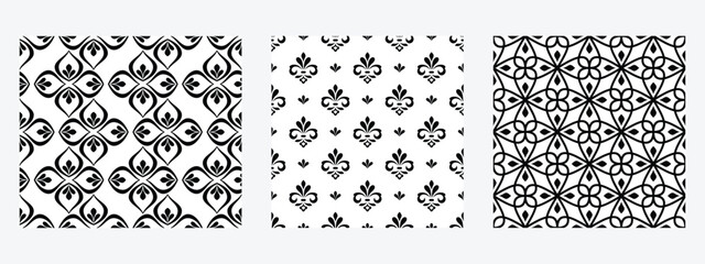 Geometric floral set of seamless patterns. White and black vector backgrounds. Damask graphic ornaments.