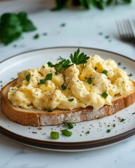 Scrambled Eggs with Toast and Garnish on Kitchen Counter