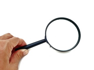 hand holding magnifying glass