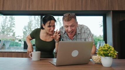 Lovely old marriage couple contact friend or relative through internet network with laptop ....