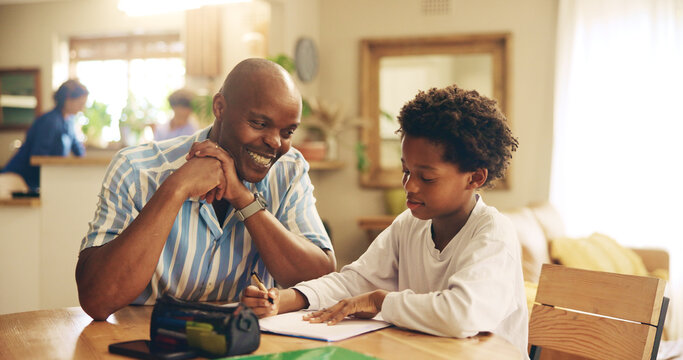 Kitchen, studying and child with dad, smile and support for son, growth or development with education. Bonding, black man and assistance for homework, writing and kid with knowledge, teaching or home