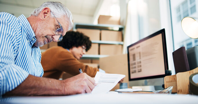 Senior man, writing and documents for distribution industry, inventory update and logistics information. People, computer and ecommerce paperwork with stock checklist, startup admin and order report