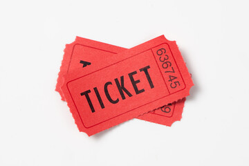 Two red vintage admission tickets