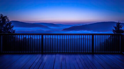 Obraz premium A wide-angle view of a wooden deck with a backdrop of mist-covered mountains and untouched wilderness.