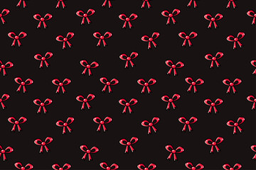 Seamless pattern with christmas red decorative outline ribbon bow on dark black background. Cute christmas coquette aesthetic bow. Use for decoration, textile, fabrics