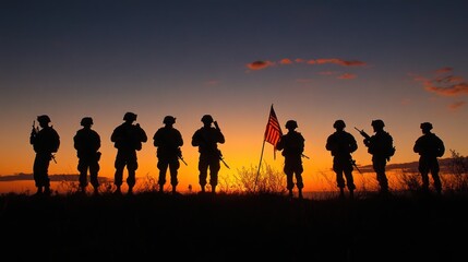 Fototapeta premium Silhouettes of soldiers standing proudly with the USA flag at sunset, a tribute to Veterans Day.
