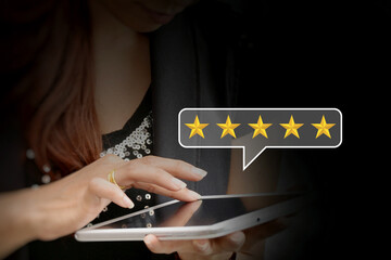 Customer review good rating concept. Man hand using smartphone with popup five star icon for feedback review satisfaction service, positive customer feedback testimonial.