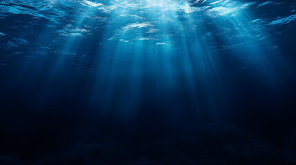 An abstract underwater image depicting the deep blue ocean, illuminated by sunlight.