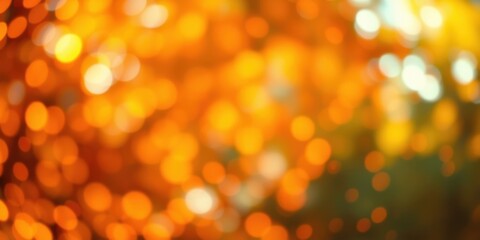 Obraz premium Abstract bokeh background with warm orange and yellow tones, creating a soft and dreamy visual effect.