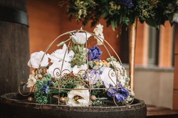 Wooden wedding interior reastaurant decoration with flowers and candles