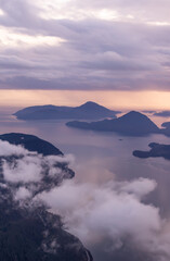 Scenic Aerial View of Misty Mountains and Islands at Sunrise