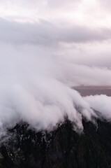 Dramatic Cloud Cover Over Rugged Mountain Peaks in Scenic Landscape