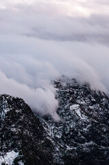 Snow-Capped Mountains Enshrouded in Mist Overlooking Howe Sound, Vancouver, BC